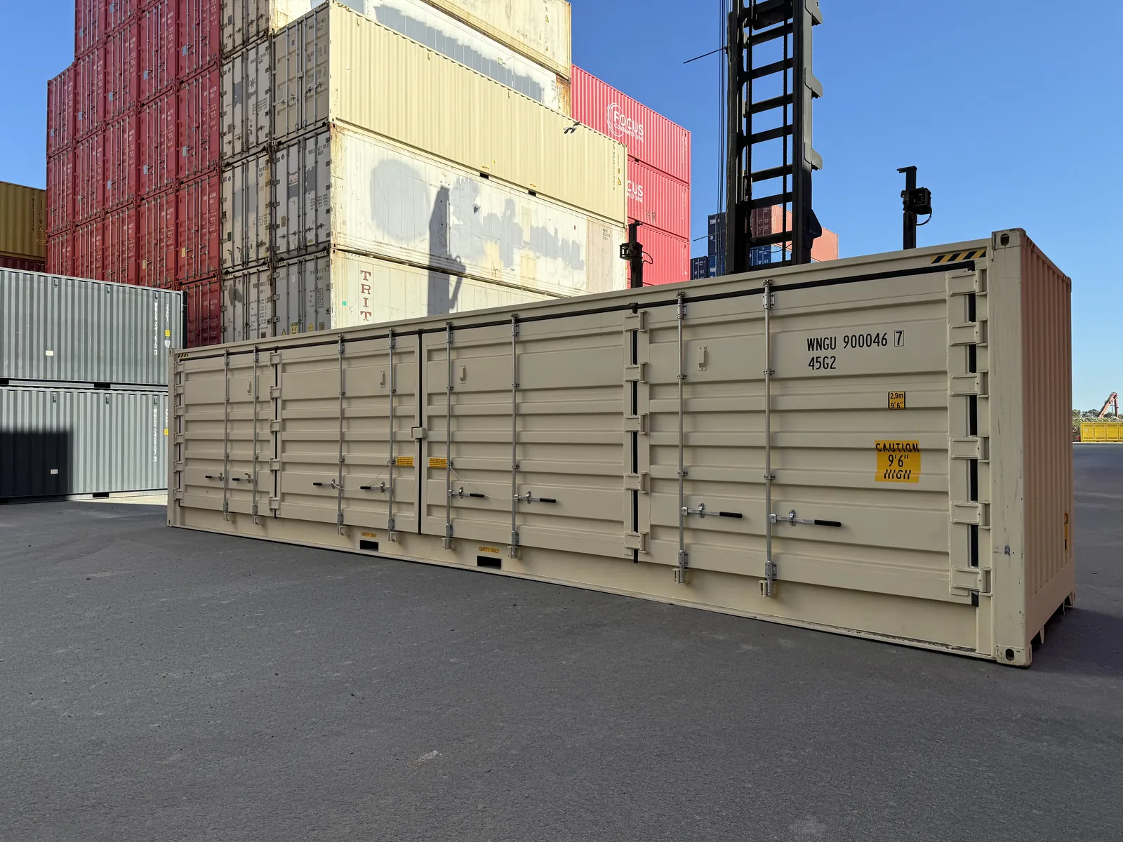 Cream 40ft side-opening container with doors along its full length